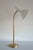 1950s Table Lamp by Harald Notini for Arvid Böhlmarks Lampfabrik, Stockholm, Sweden. Adjustable arm in brass with a white...