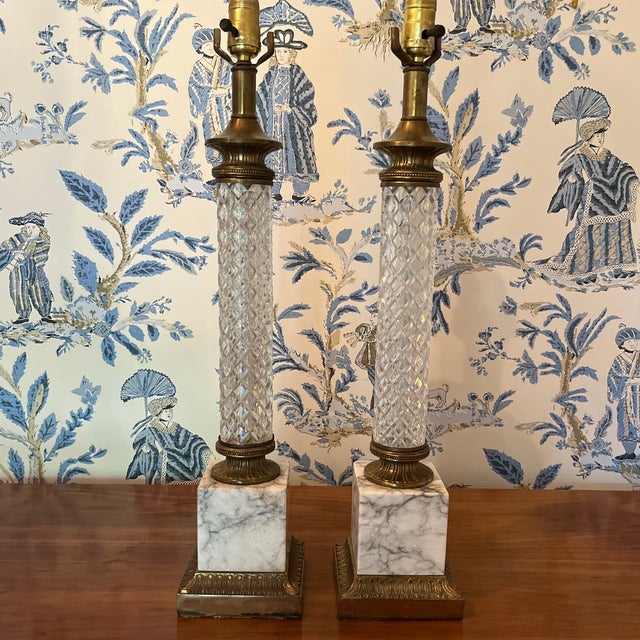 Neoclassical mid-century lamps with classic diamond pattern crystal, and veined marble base. Brass hardware with aged...