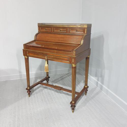 A top quality French rosewood brass inlaid desk, with tambour front, you have to pull open the drawer to release the...