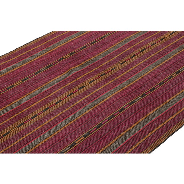 Handwoven in wool circa 1950-1960, this vintage 6x11 Persian Kilim from Kurdistan employs the distinct “palas” weaving...