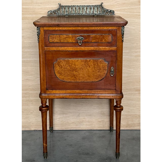 Pair of French Oak Nightstands with Door and Bronze Crest Height from the floor to the wood top : 30.90in