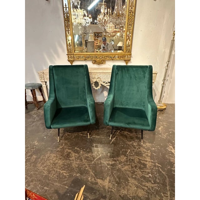 Handsome pair of Italian green velvet Mid-Century modern high back chairs after Marco Zanuso. Makes a stylish statement!