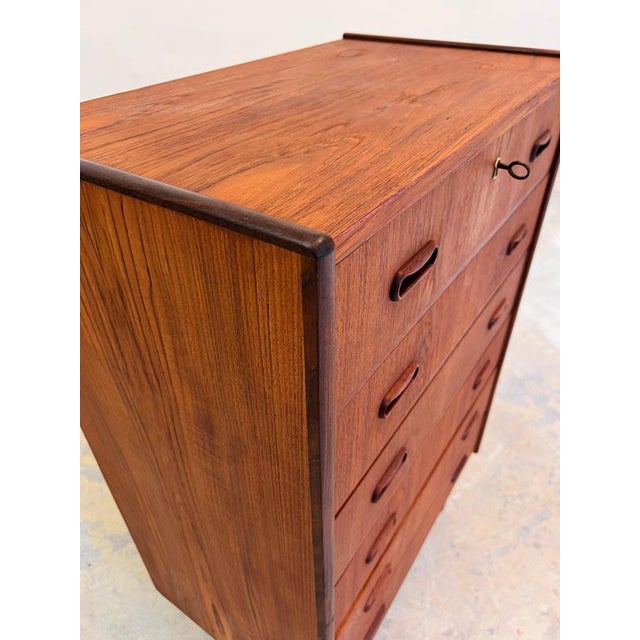 This Danish chest of drawers from the mid-century era is a masterful example of Scandinavian design perfection and...