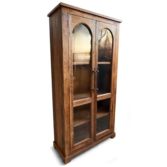 Beautiful salvaged wood display cabinet with arched design glass panel doors. Walnut brown finish enhances the natural...