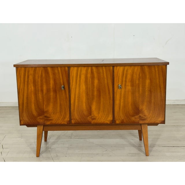 For sale is a very nice vintage dresser. • German design • 1960s • Key included • Good condition Dimensions: Height: 75 cm...