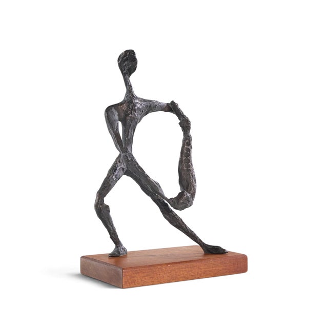 Simon Gordon Mid Century Brutalist Iron Sculpture Man with Fish This sculpture measures: 8.25 wide x 6.25 deep x 13.25...