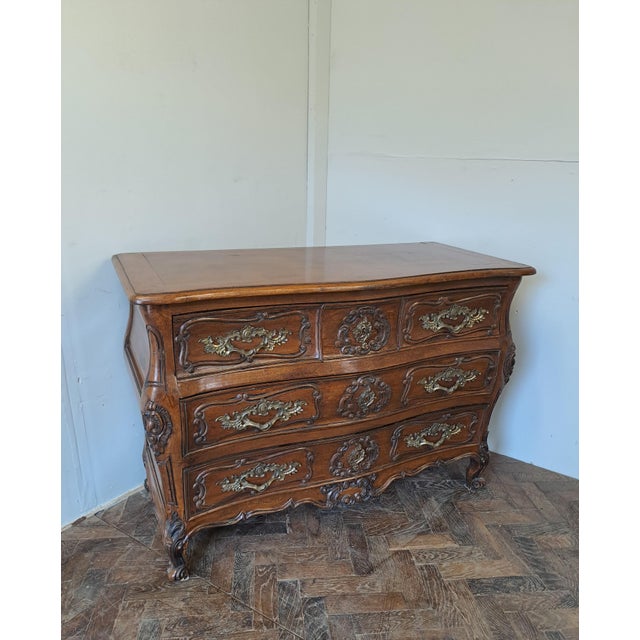 A handsome early 20th-century French walnut commode, made in the 18th-century manner, beautifully proportioned and richly...