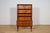Teak wood shelf made in Denmark in the 1960s. In the upper part there are four open shelves, at the bottom there are two...