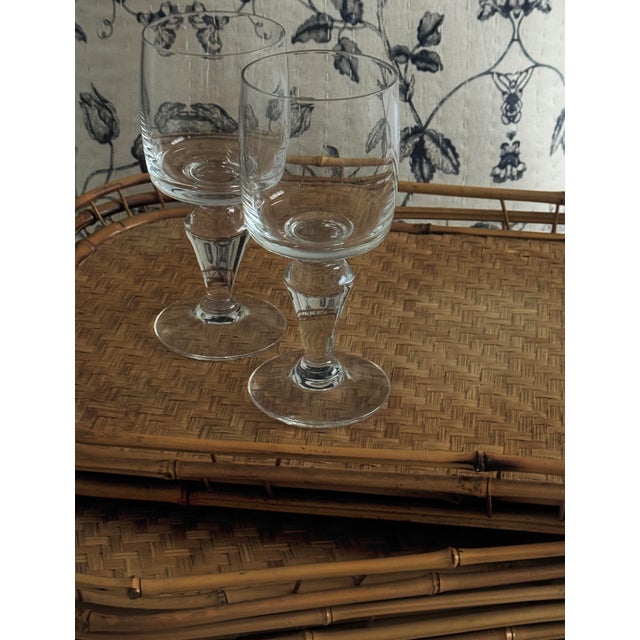 A set of mid-century rattan trays made during the 1960s, reflecting the structure and functional clarity associated with...