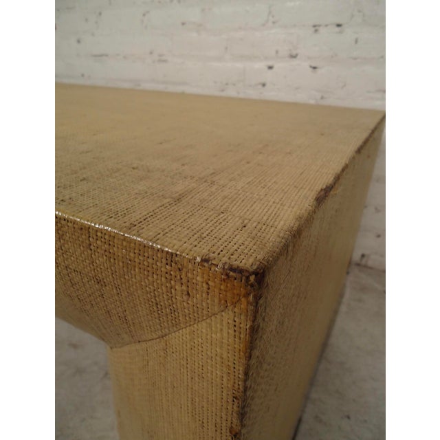 Table with beige color cloth and brass trim base. Table has been lacquered to prevent further fraying. (Please confirm...