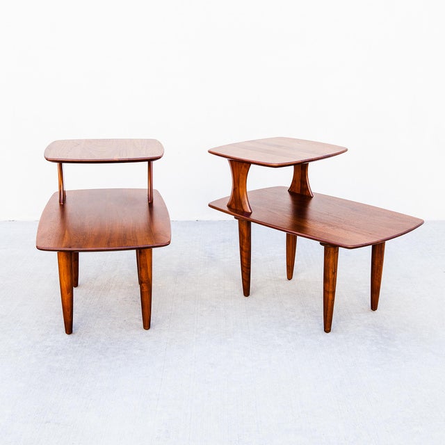 An expertly refinished pair of solid walnut two tier side / end tables with beveled edges by Ace Hi, made in Southern...