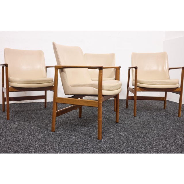 An exceptionally rare and complete set of 4 matching conference chairs designed by ib kofod-larsen and manufactured by...