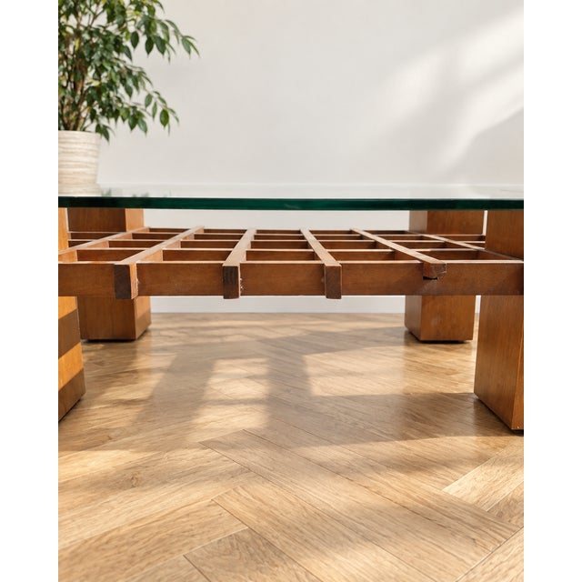 An elegant coffee table made in Italy in the 1970s. The piece stands out for its solid, sculptural wooden structure...