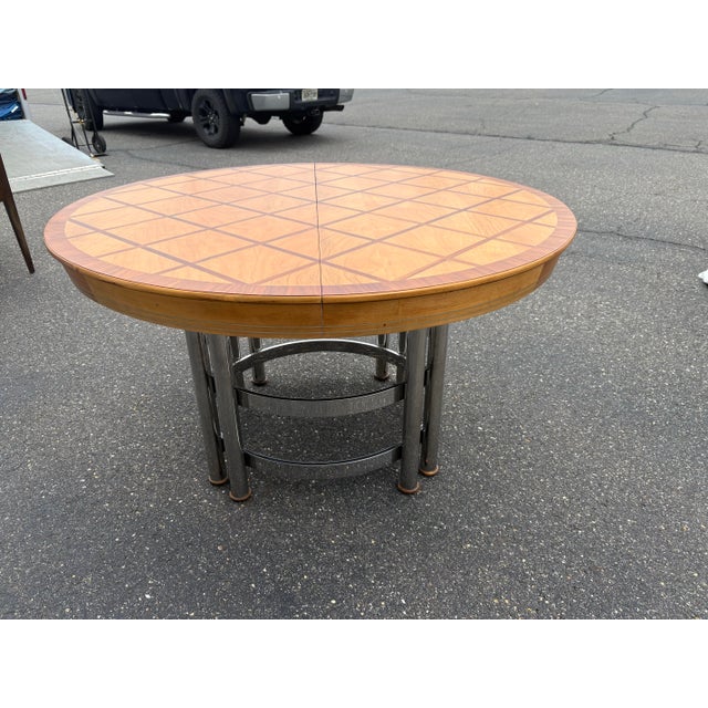 Marvelous designer birch and walnut marquetry top dining table. High quality build. The chrome base is very heavy and the...