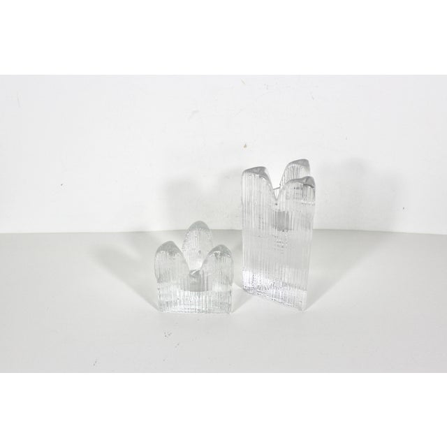 Stunning pair of triangular clear glass candle holders designed by Anna Ehrner for Kosta Boda in Sweden. In excellent...