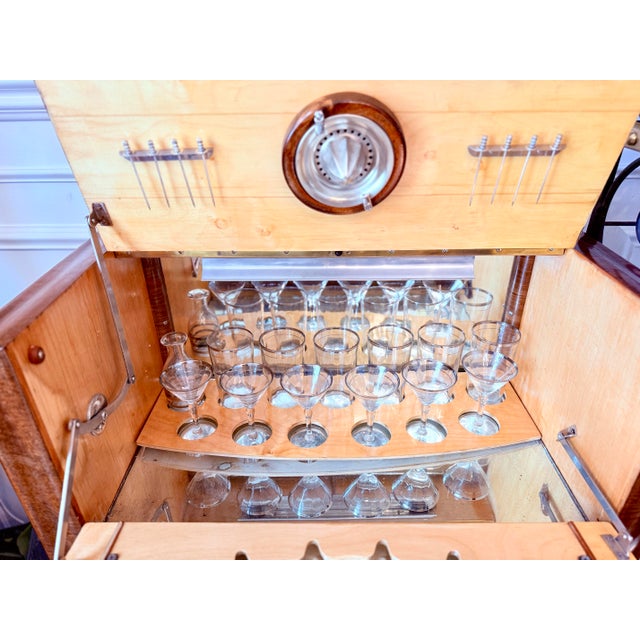 This is an 1930’s Art Deco burr walnut cocktail cabinet / Dry Bar Server. The exterior showcases richly figured burr...