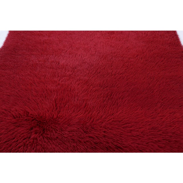 Made with hand-knotted high-pile wool in Turkey, this 6x7 vintage Tulu rug is a distinguished addition to Rug & Kilim’s...