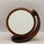 A beautiful brown translucent plastic mirror with magnifying glass on one side and a traditional mirror on the other. Can...