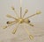 Mid Century modern brass geometric chandelier with twelve arms. Frequently called Sputniks, these Atomic Age starburst...