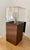 This pair of dual-light sconces made by Lightolier circa the 1970s featuring a plexiglass cube holding the upper light,...