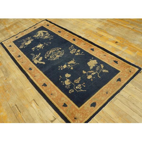 Antique Chinese - Peking Small Scatter Size Wool Blue Rug, Circa Date: 1900s. This exquisite example of early 20th-century...