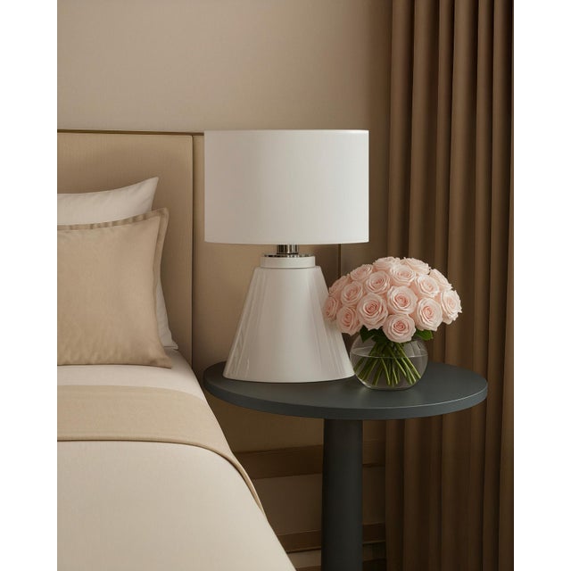 "The bed is unmade. The day is breaking." Simple and chic are the two words that characterize the Ivresse Blanche lamp....