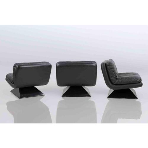 Set of 3 Vintage Space Age Black Leather Lounge Chairs on a black pyramid acrylic base. In excellent condition, with their...