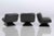 Set of 3 Vintage Space Age Black Leather Lounge Chairs on a black pyramid acrylic base. In excellent condition, with their...