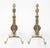 A fine pair of brass andirons with scrolling etched designs. The flame finials over diamond squares above a vase form body...