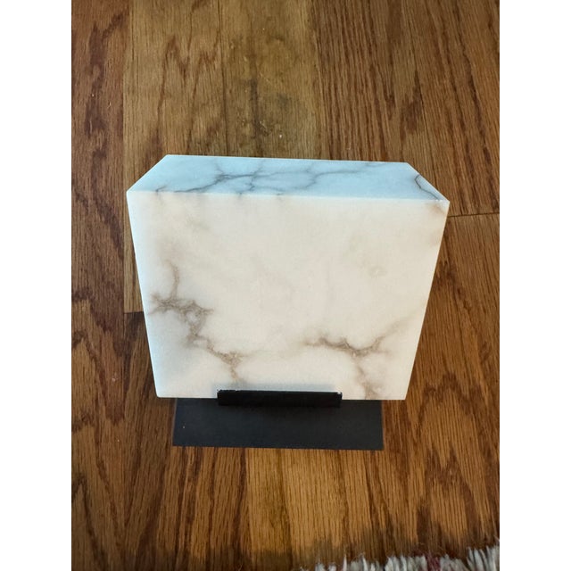 Designed in 1923, the rigorous geometry and single volume of this wall lamp reveal the mineral nature of alabaster and...