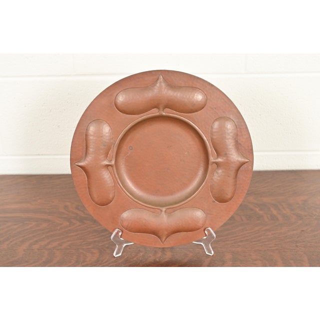 A gorgeous Arts & Crafts hammered copper charger plate or tray In the manner of Roycroft By Ramon Ramirez Mexico, Mid-20th...