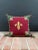 French style throw pillow with a wool needlepoint fleur-de-lis design. Backed in tan cotton velvet with green cord trim....
