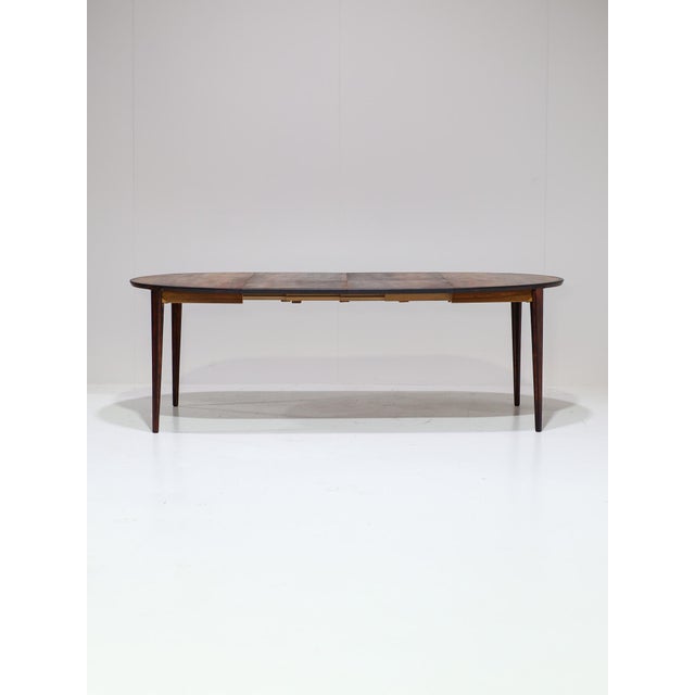 Rare extendable dining table designed by Henry Rosengren Hansen for Brande Møbelindustri in Denmark, 1960s. This round...
