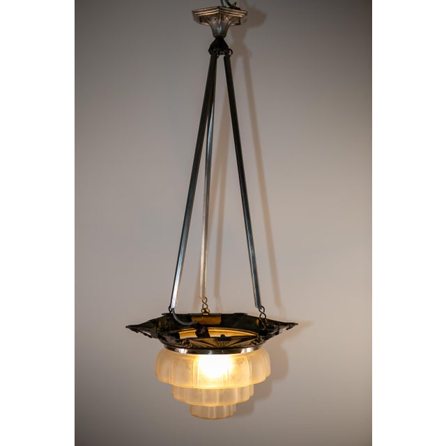Art deco lamp from france, circa 1930. the lamp's frame is made of cast zinc, which is well-preserved and has developed a...