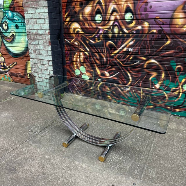 This elegant dining table by Romeo Rega is as much of a sculptural art piece as it is a functional dining table. The art-...