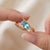 Capture serenity and sophistication with this lovely bypass ring featuring a brilliant marquise-cut Blue Topaz. Designed...