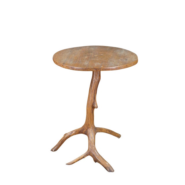 This rustic Adirondack accent table beautifully marries organic artistry with functional design, showcasing a round, rich...