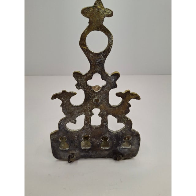 An authentic antique North African (Moroccan) cast brass Hanukkah lamp (Hanukkiah), designed for both wall-hanging (via...