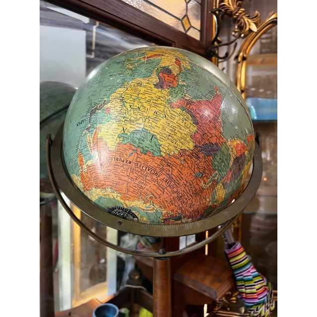 Up for consideration is a beautiful vintage wooden MCM standing globe. This would look lovely in your home, and it is the...