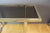 Chrome metal console and golden metal, top of smoked glass, around 1970, set in very good condition This piece is designed...