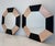 Elegant pair of Italian wall mirrors defined by their distinctive octagonal shape and bold geometric structure. Each...