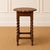A masterwork of Victorian craftsmanship, this antique English oak side table commands attention through its expertly...