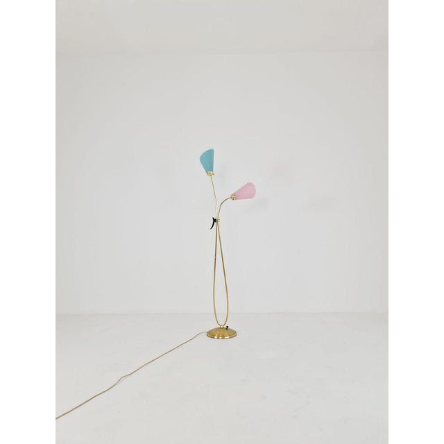 Mid century brass German Arc floor lamp with flex arms, 1960s Raffia umbrellas in a stylish 50s The frame is made of...