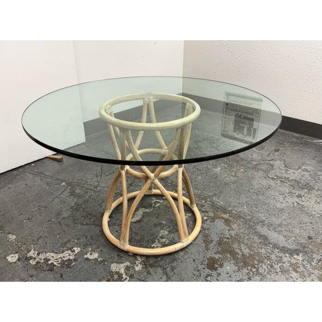 Design Plus Gallery presents a Vintage Round Dining Table by McGuire Furniture, based on the original design by Elinor...