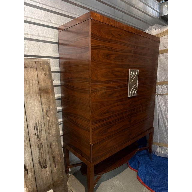 Decca Home Bolier Rosewood Armoire Engineered rosewood veneer tall cabinet. Prettiest grain and decorative accents in a...