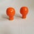 Pair of orange, large round, organic shaped, ceramic lamp finials. These ceramic finials were first hand-formed in clay,...