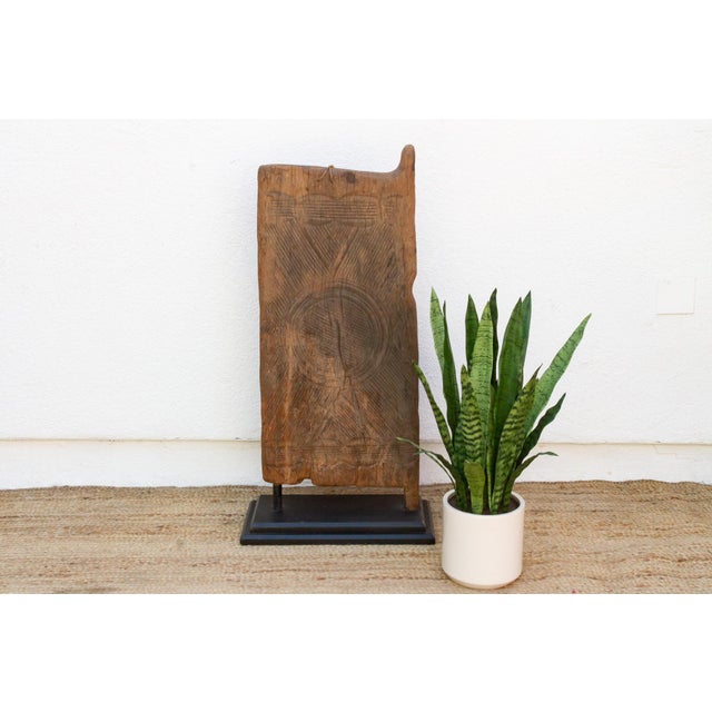 Carved from heavy hardwood in southeastern Nigeria, this small door reflects the tradition of Igbo carved doors and panels...