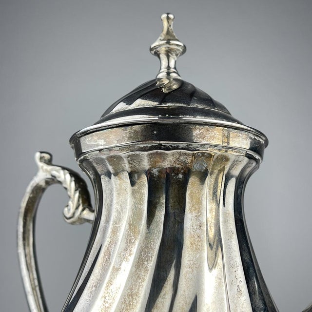 Elegant vintage coffee pot featuring a beautiful heraldic-style "Royal Sheffield" mark on the base. Likely produced in the...
