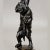 A great victorian casted iron candlestick, germany, circa 1860. Depicting a mother bear holding one cub in her left paw...
