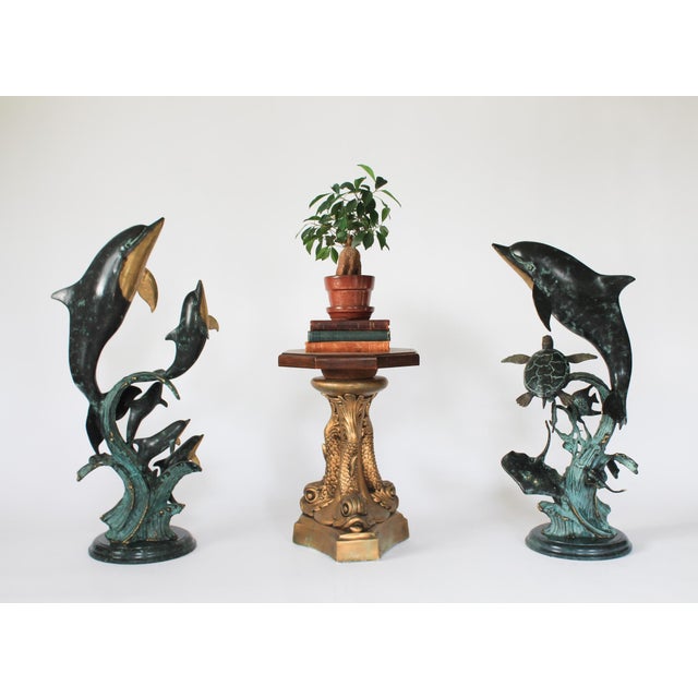 Pair of multi-dolphin / sea life gallery brass sculptures by SPI San Pacific International. Each sculpture features a...